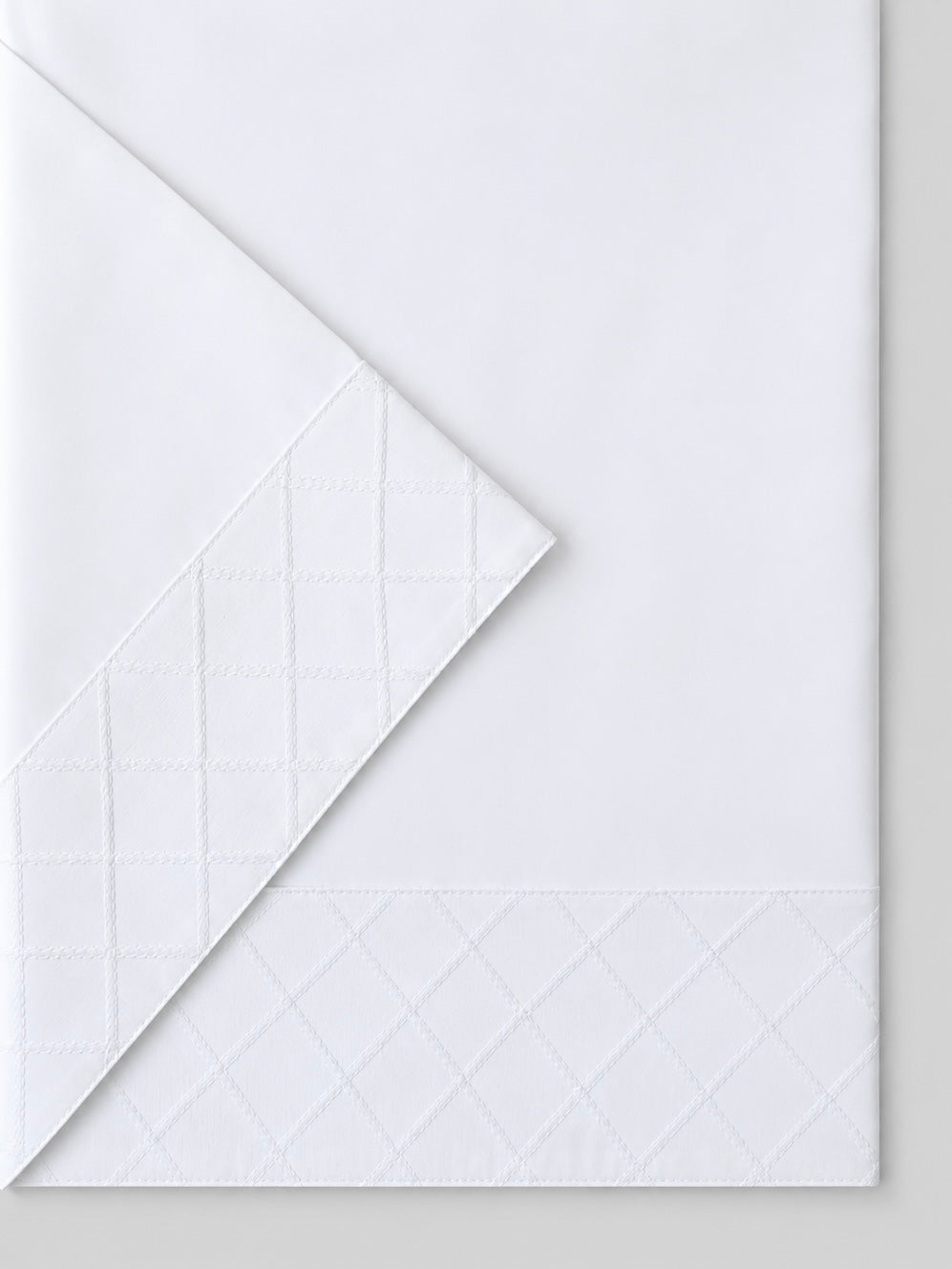 JUEGO DE SÁBANAS ROMBOS BLANCOS